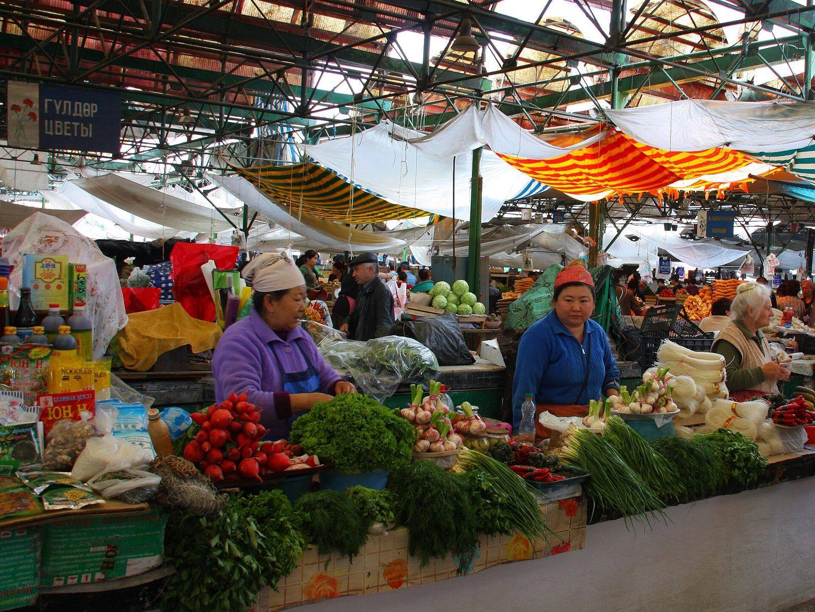 Produce stalls in a covered bazaar