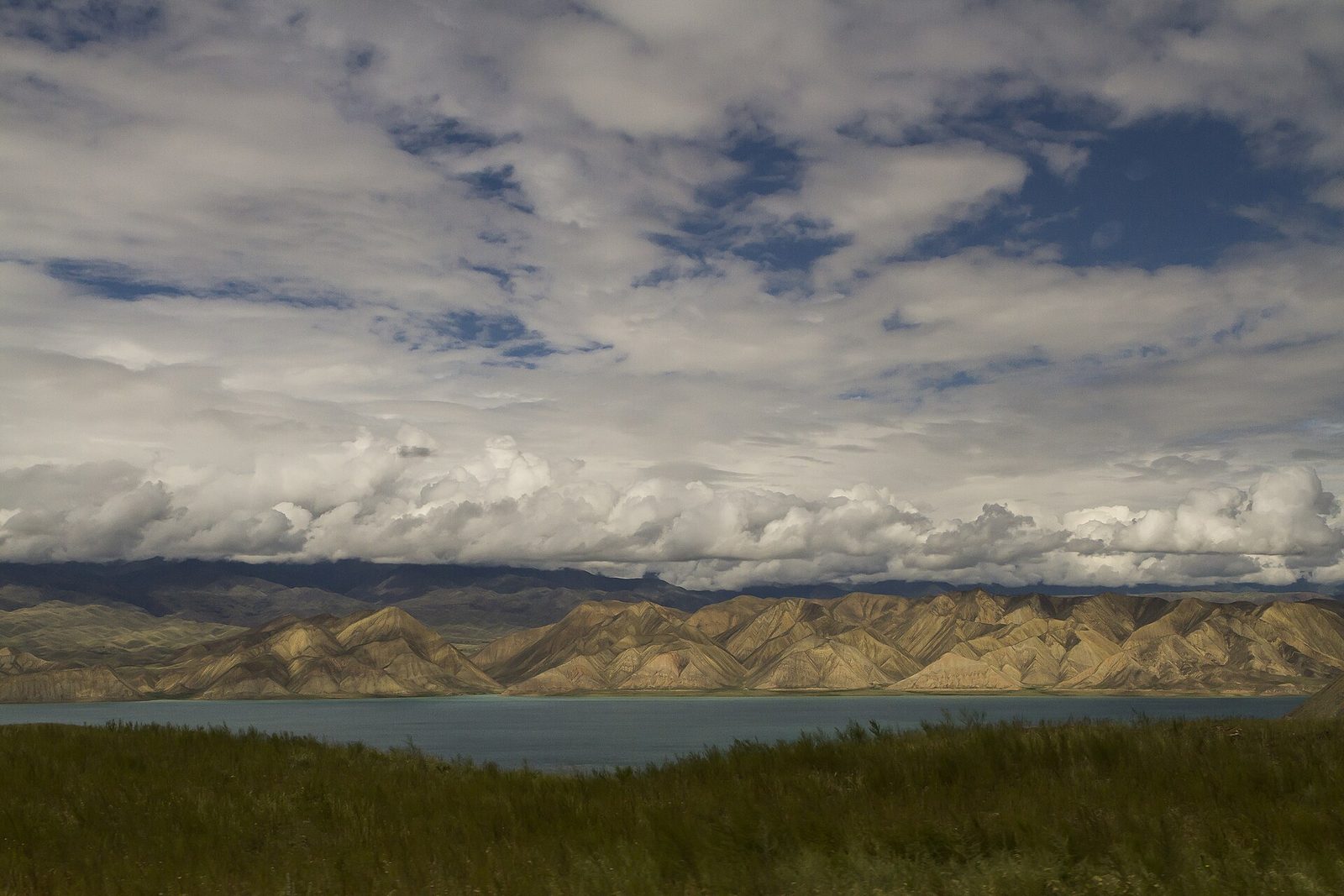 Toktogul reservoir under cloud